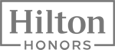 The image displays the logo text "Hilton Honors" with a rectangular border around it, representing a hotel loyalty program.