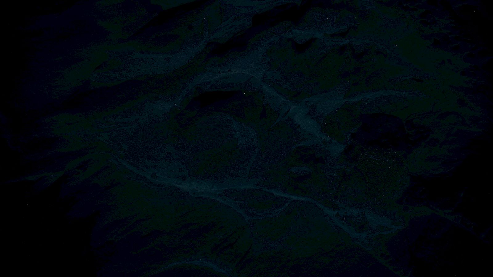 The image appears very dark, displaying an abstract or indistinct pattern with various shades of blue and black.