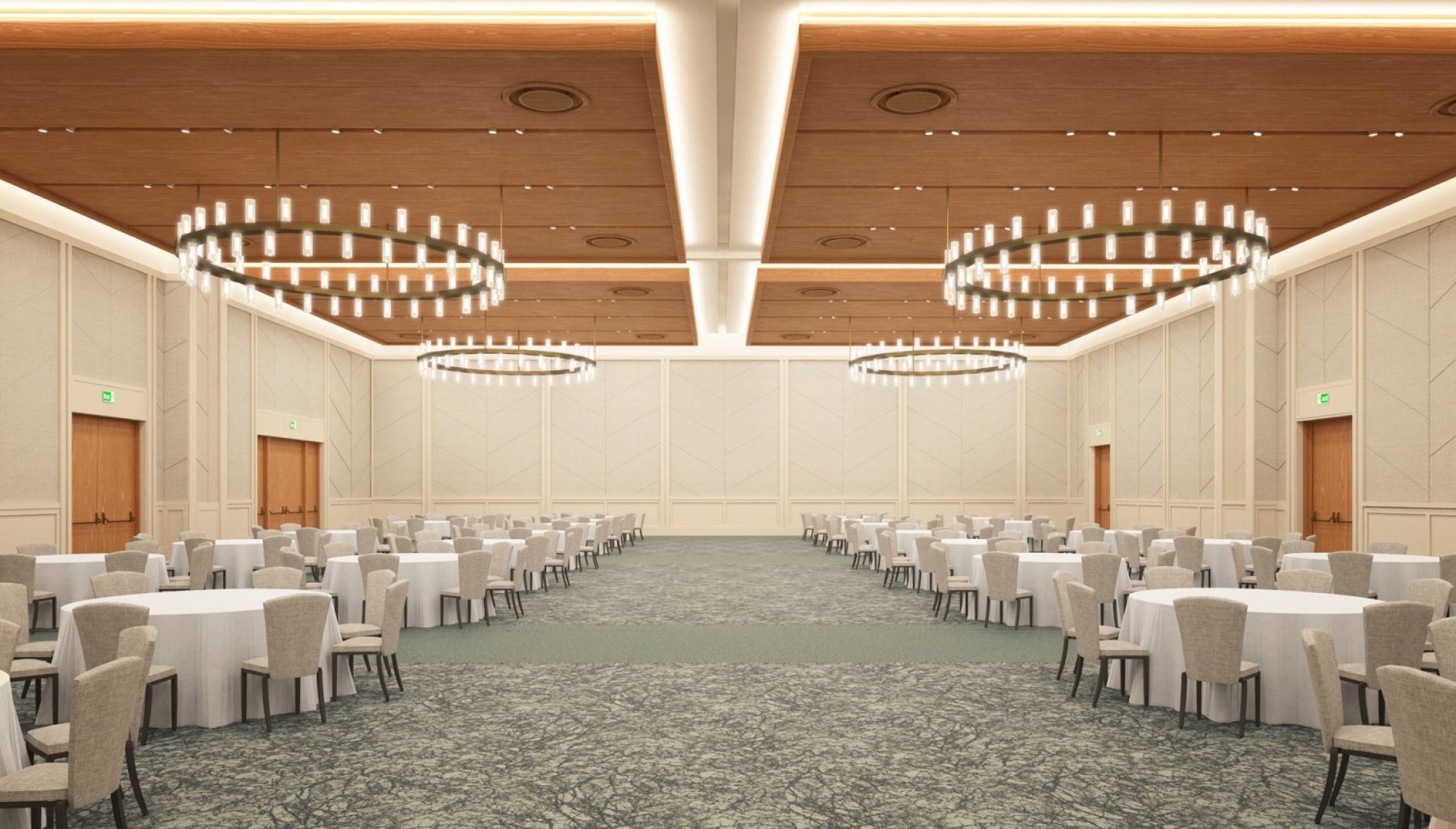 A large banquet hall with round tables and chairs, two large chandeliers, and wooden doors.